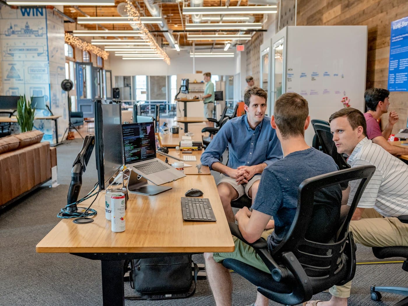 Founder reviewing an online store on a laptop in a bright workspace
